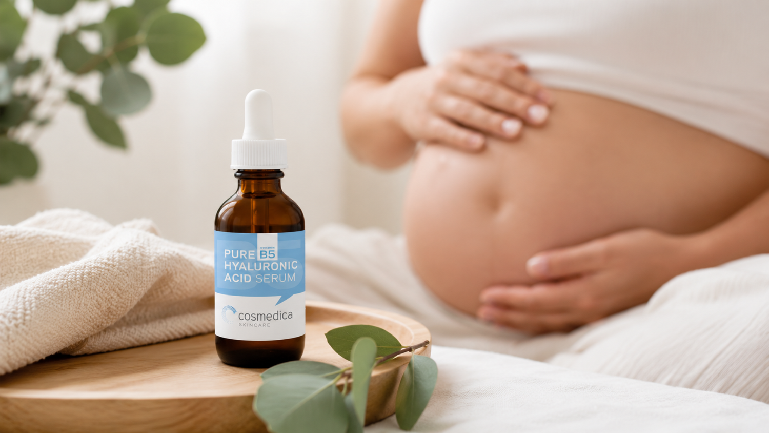Pregnant woman using hyaluronic acid serum for hydrated skin 